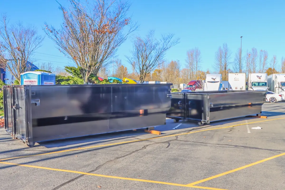 Professional dumpster rental service with roll-off container on residential driveway in Antigo